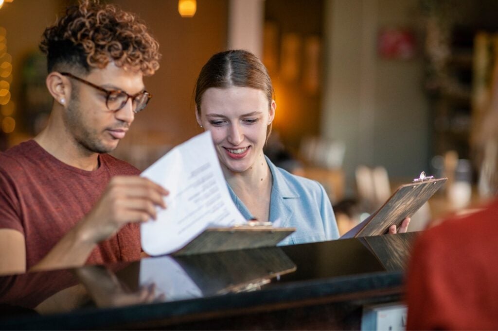 2 people looking at clipboards
