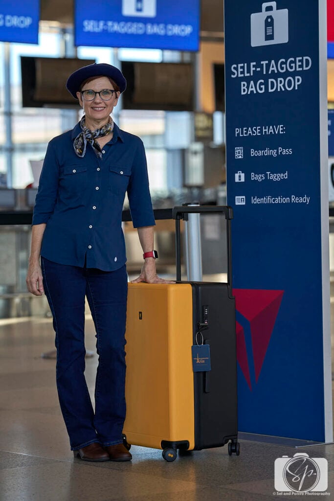 Andi in RDU airport with her Level8 Suitcase