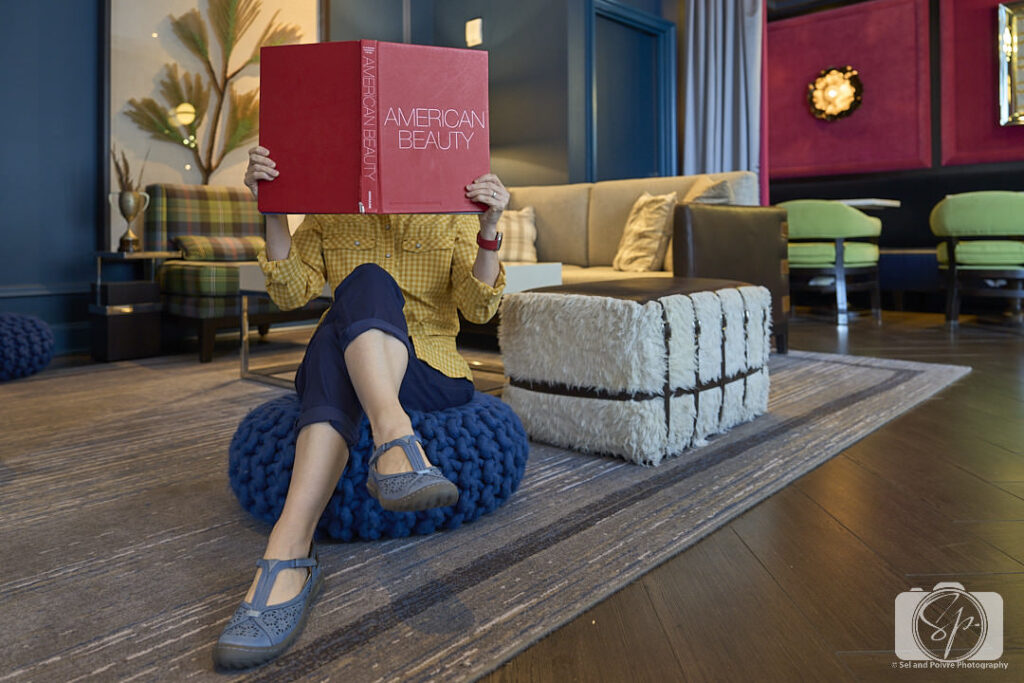 Andi in the living room of the Kimpton Cardinal Hotel with Jambu Daffodil shoes