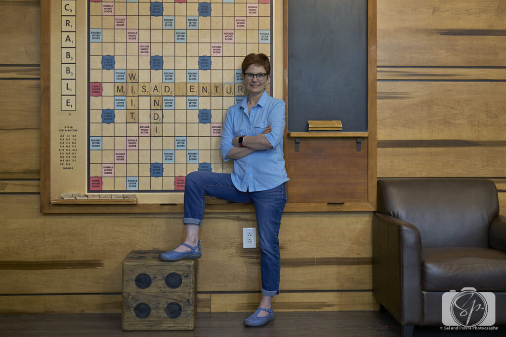 Andi in the Rec Room of the Kimpton Cardinal Hotel with Jambu Daffodil shoes