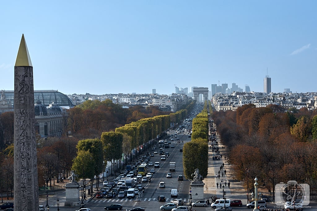 A piece of the Luxor Obelisk, Champs-Élysées and Arc de Triomphe.