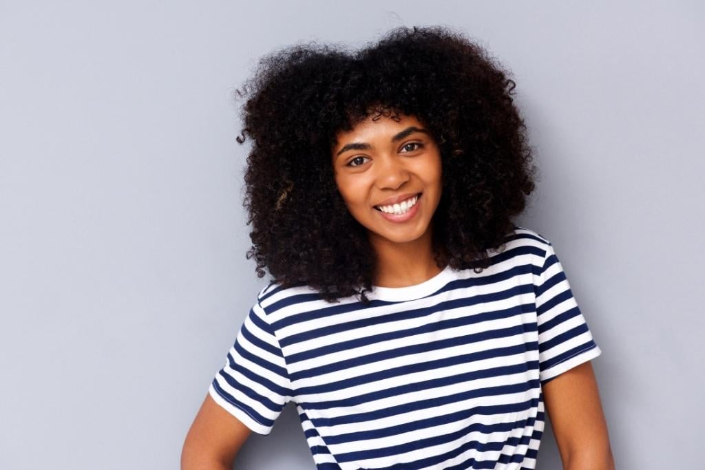 black girl in blue and white striped shirt