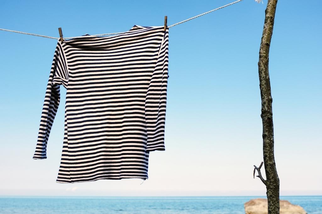 blue and white striped shirt hanging on a line