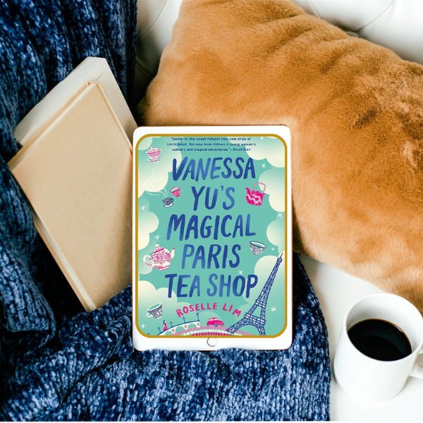 couch with e-reader with book Vanessa-Yus-Magical-Paris-Tea-Shop