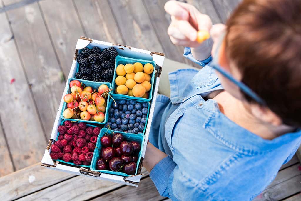 Eating fruit at the Billings Montana Yellowstone Valley Farmers Market