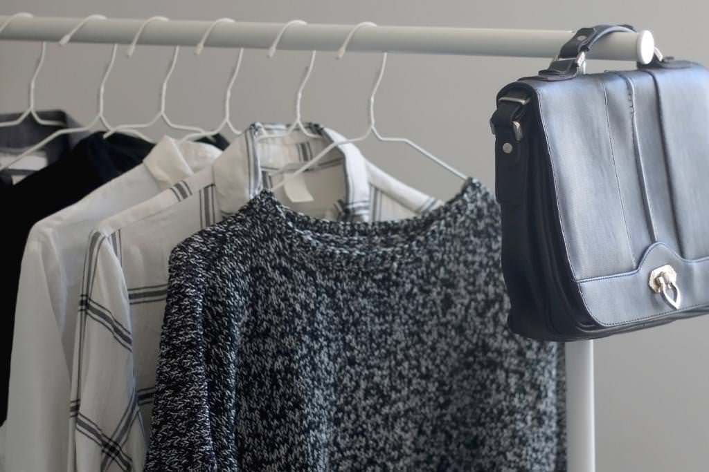 shirts and sweaters on hangers