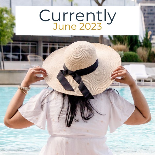 Girl in a hat by the pool