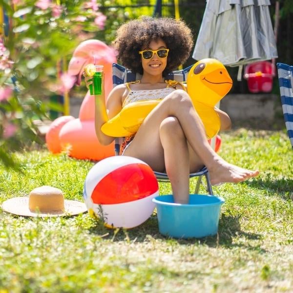 girl with feet in bucket