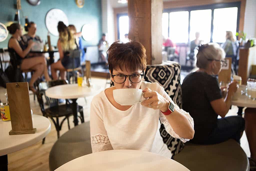 Having Coffee at the Sassy Biscuit in Billings Montana in the Chico's Summer Travel Collection