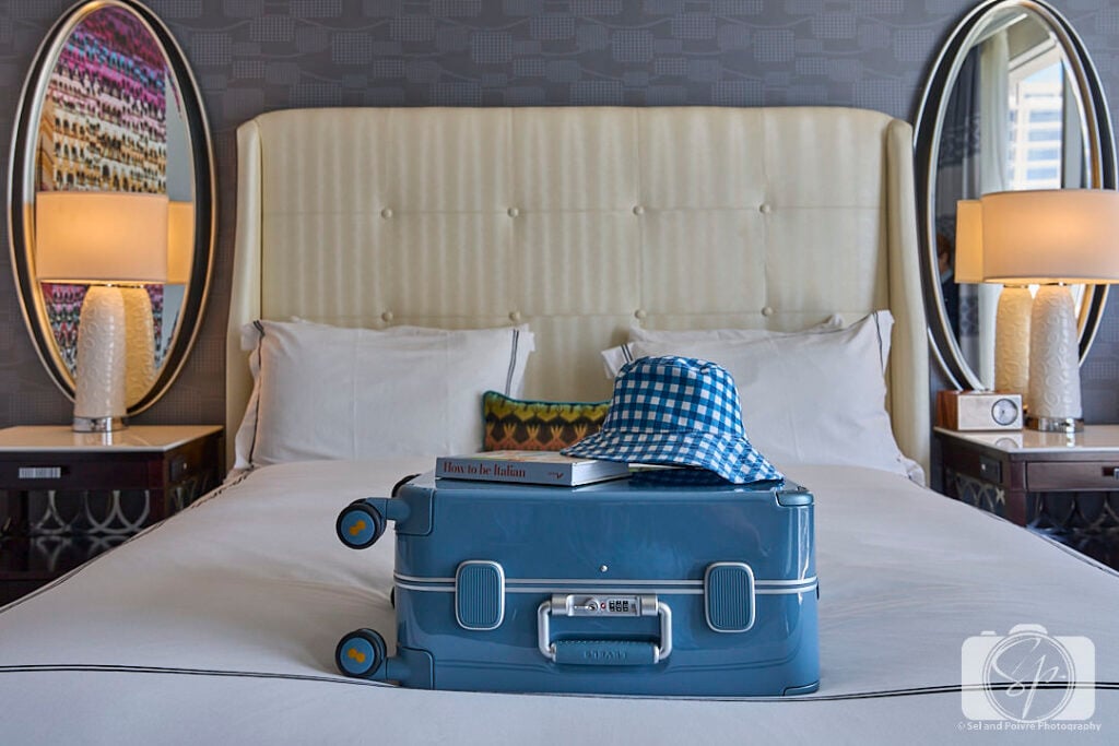 Level8 Freeloop Suitcase on top of the bed at the Kimpton Tryon Park Hotel