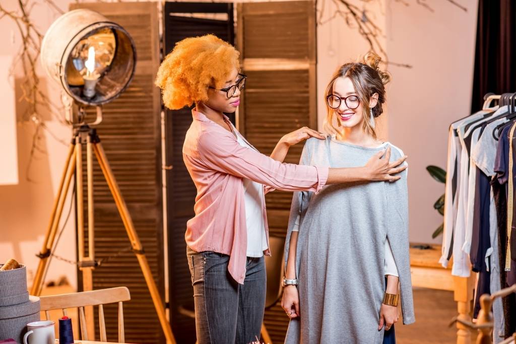 2 girls tailoring clothes