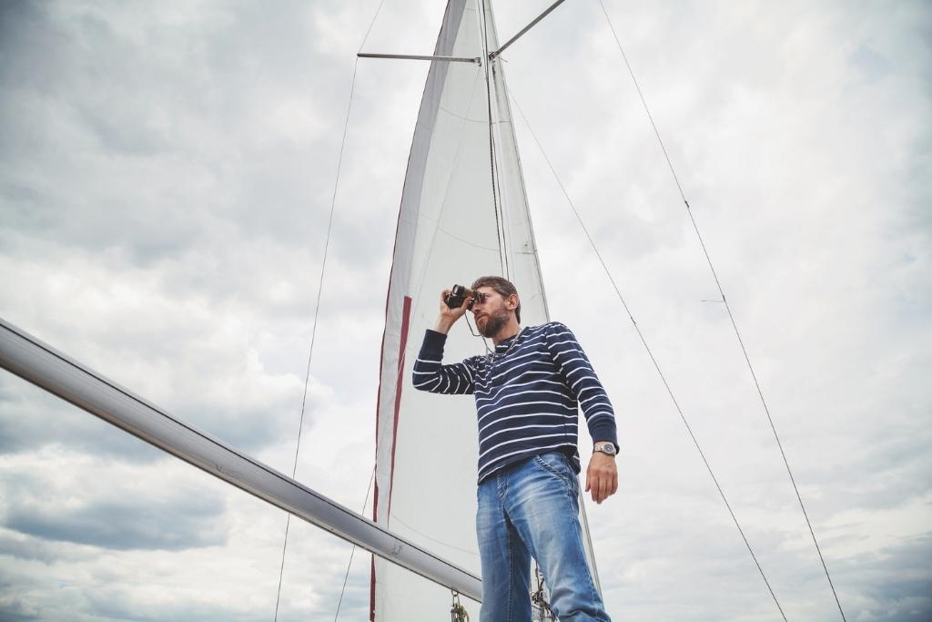 man in blue and white striped shirt on a boat