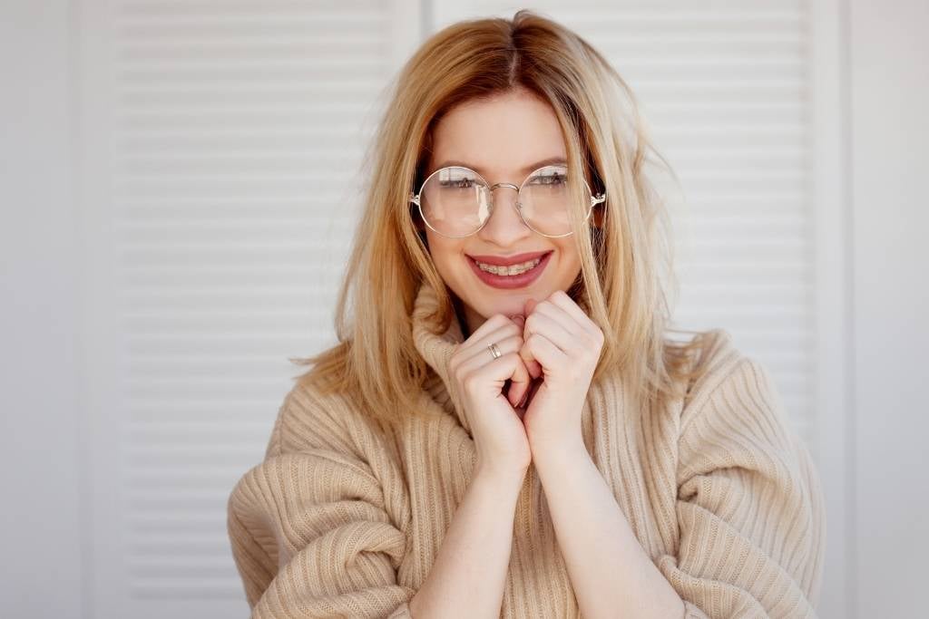 girl in glasses and oversized sweater