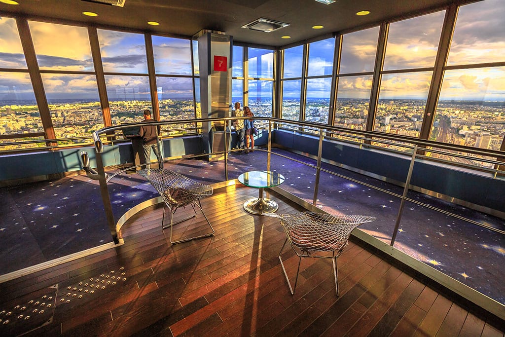 Paris at sunset inside Montparnasse Observation Deck
