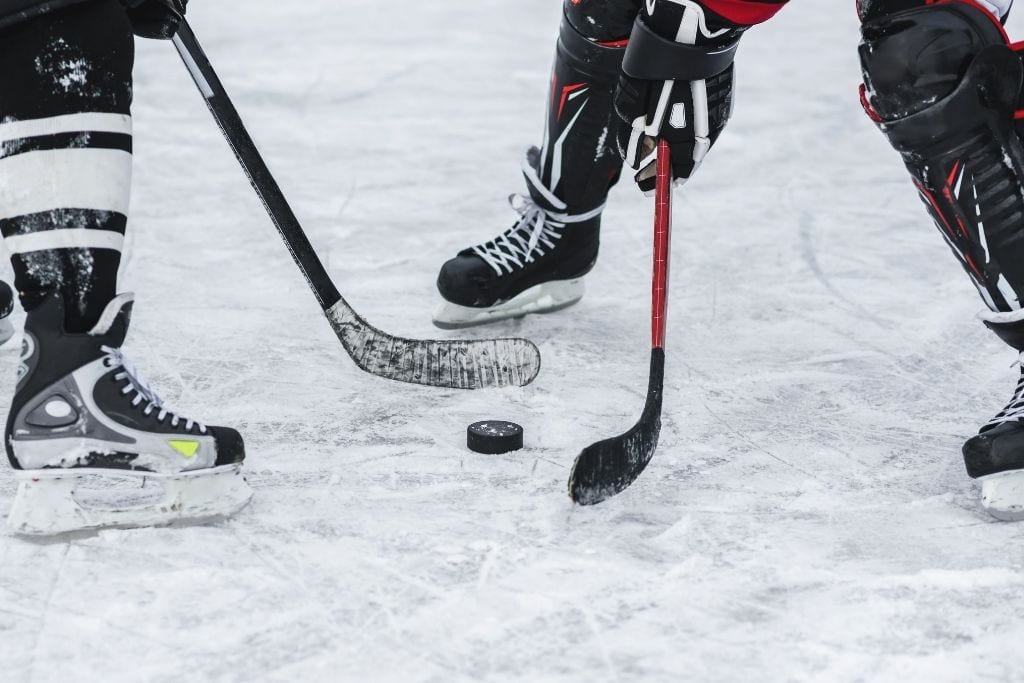 photo of 2 people playing ice hockey
