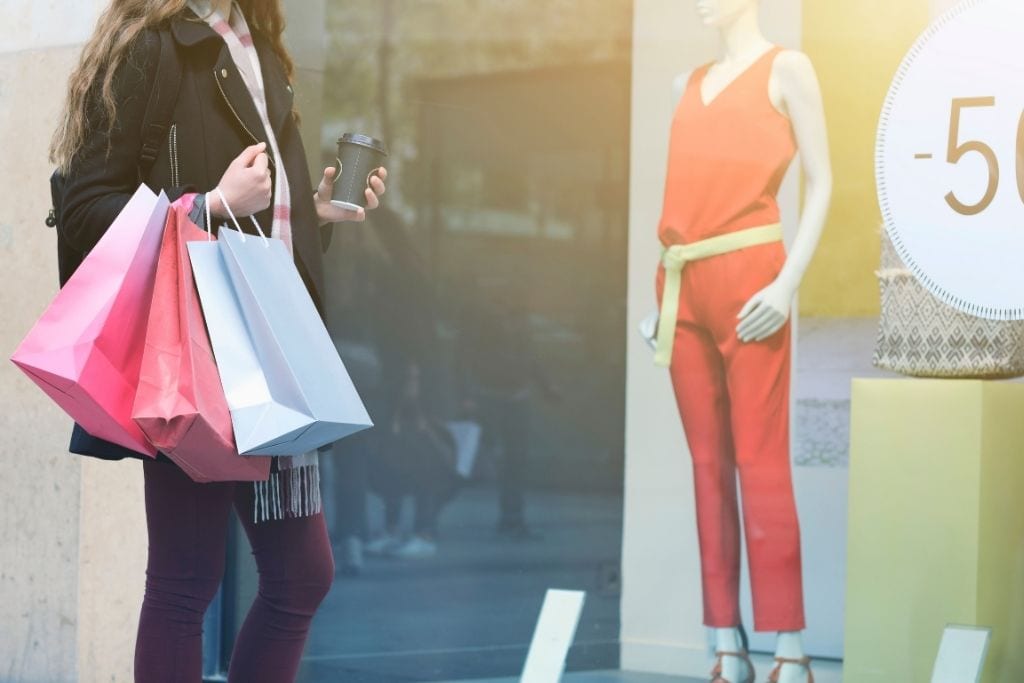 photo of a girl window shopping in paris