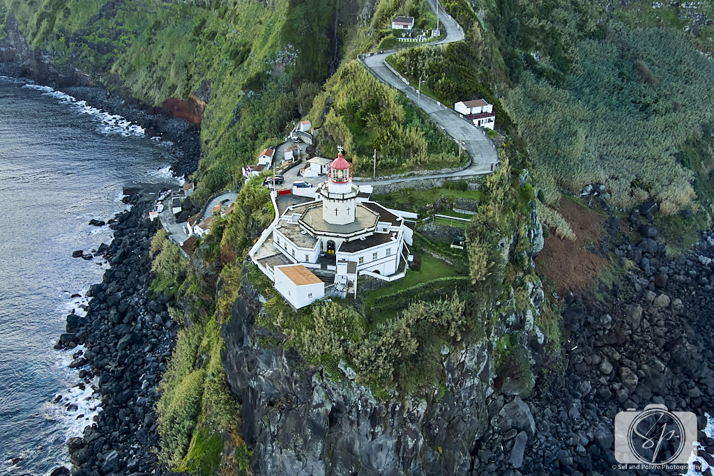 Portugal-Azores-Sao Miguel drone shot of Arol do Arnel lighthouse