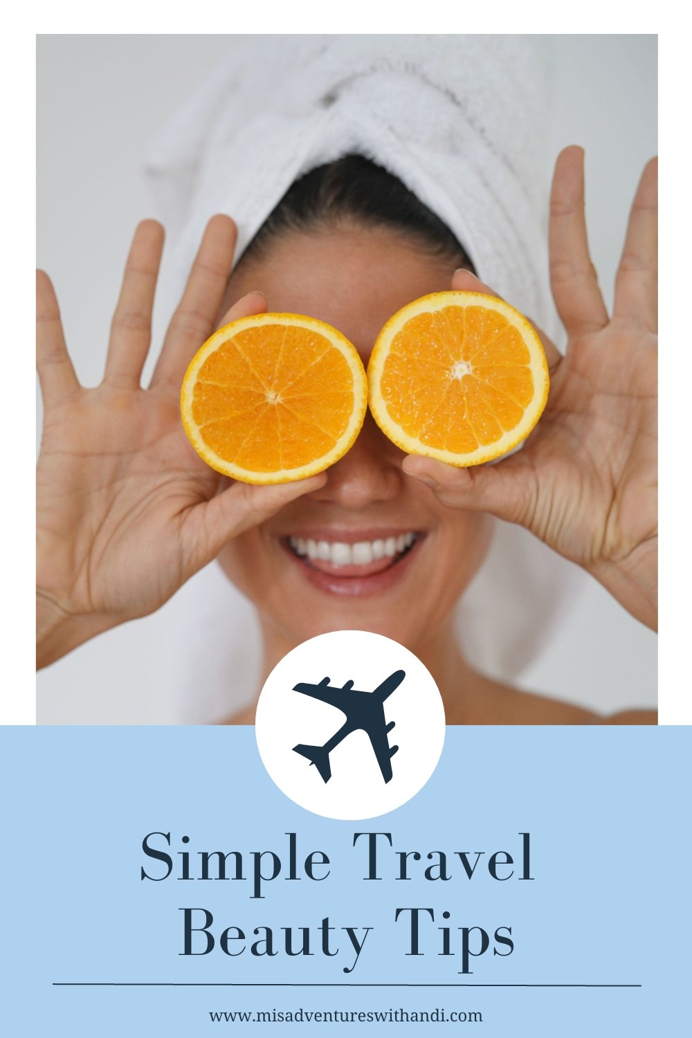 beauty in towel turban smiling with oranges