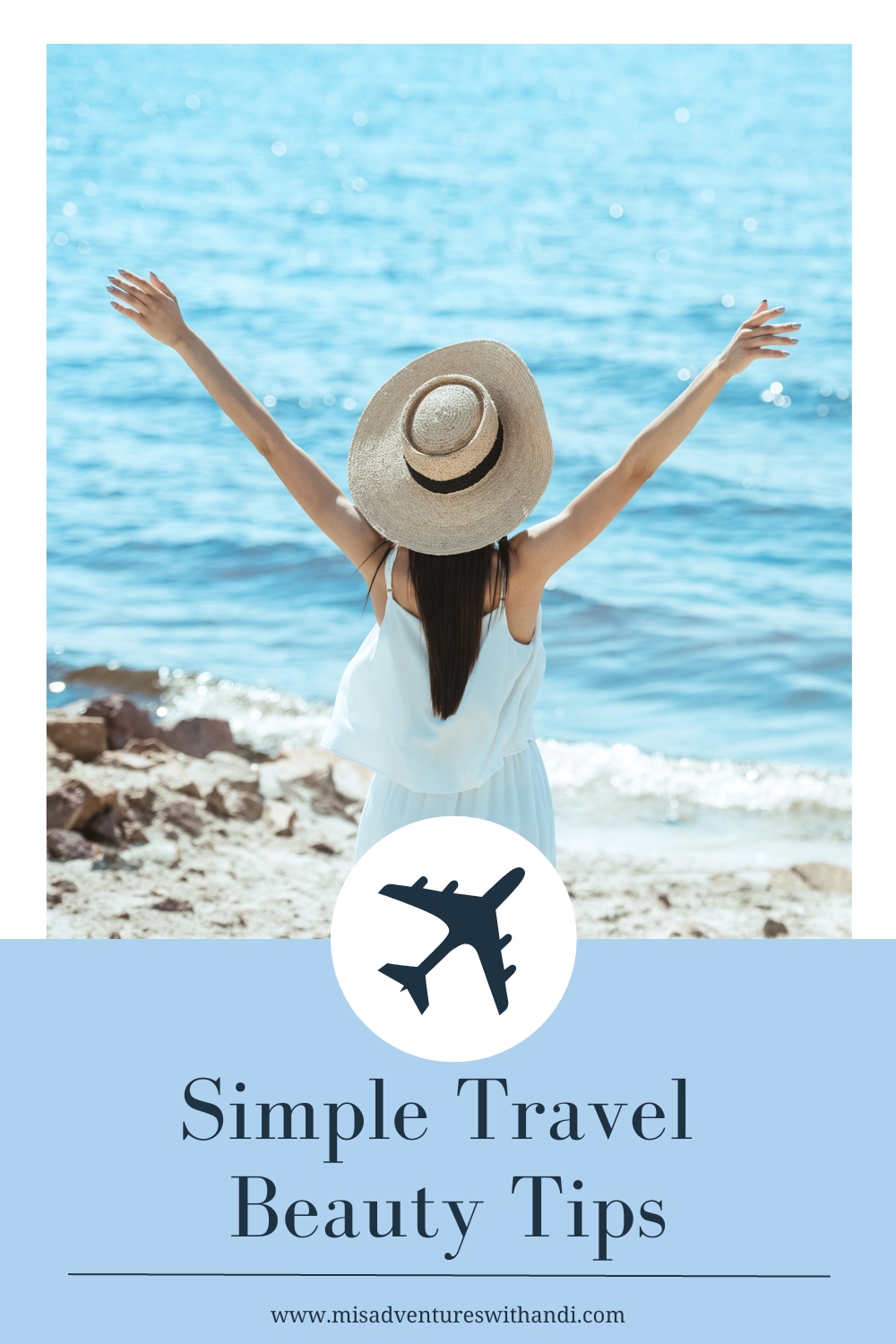 girl with arms up at the beach