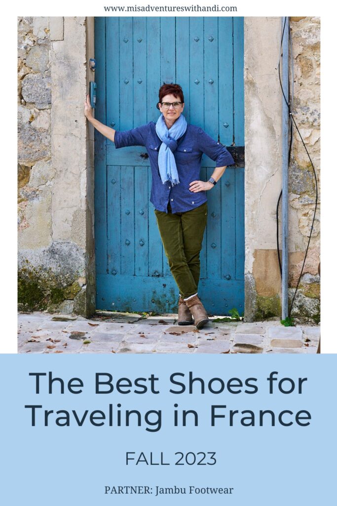 woman standing by a blue door