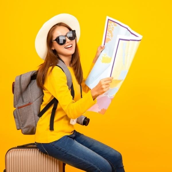 Girl sitting on suitcase