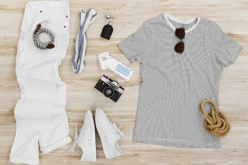 white pants striped shirt laying on floor