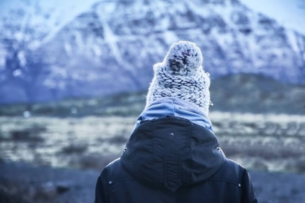 winter travel photo in snow back of woman