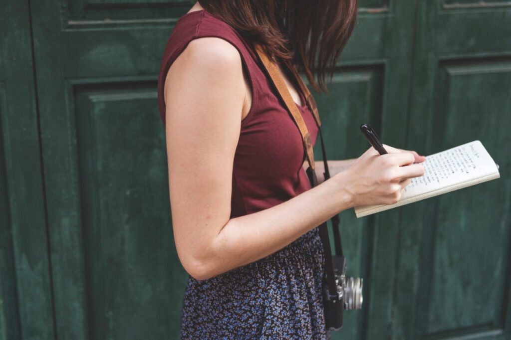 woman taking notes in Paris