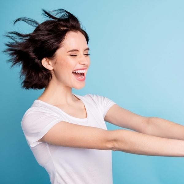 woman with black hair flying
