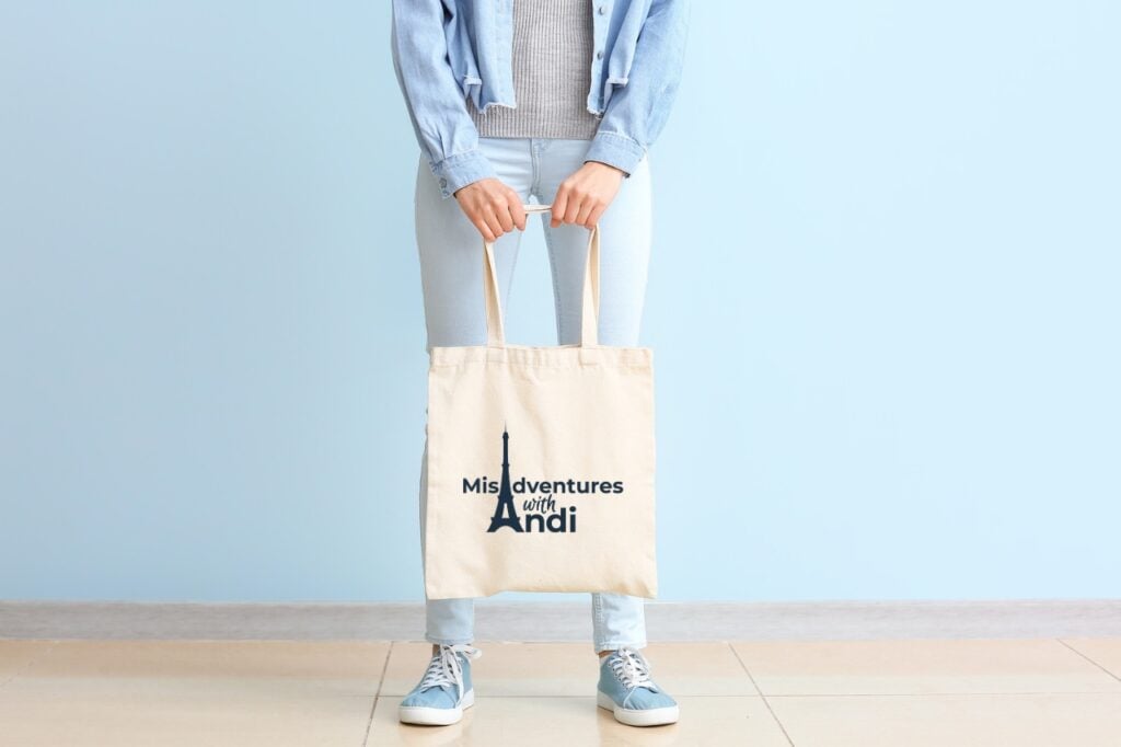 Young woman with eco bag against color wall